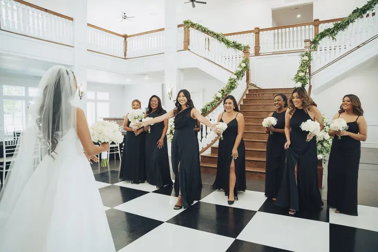 The bridesmaids see the dress for the first time