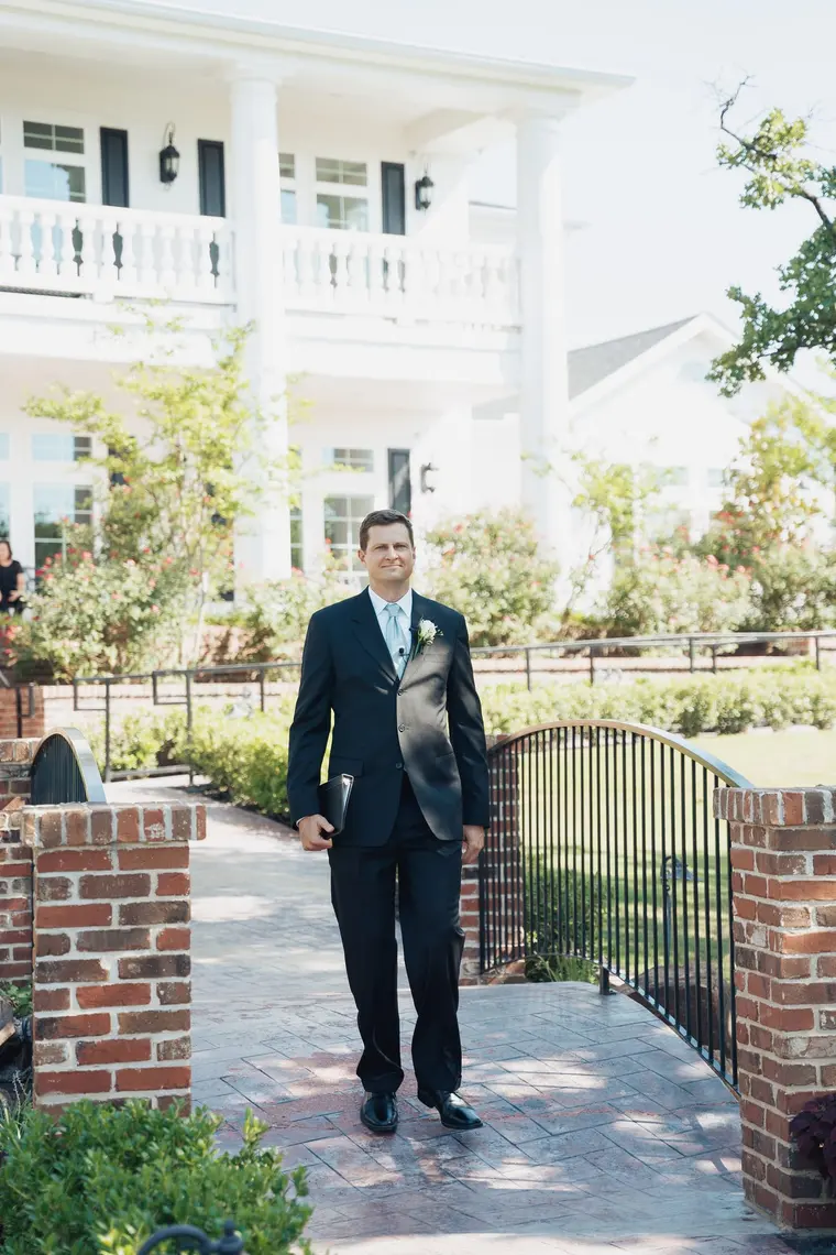 The officiant walks out to the ceremony