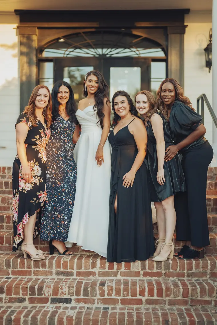 The bride with friends on the steps