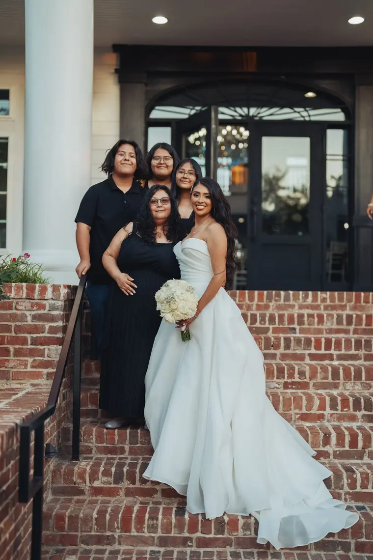 The bride with her family on the brick steps
