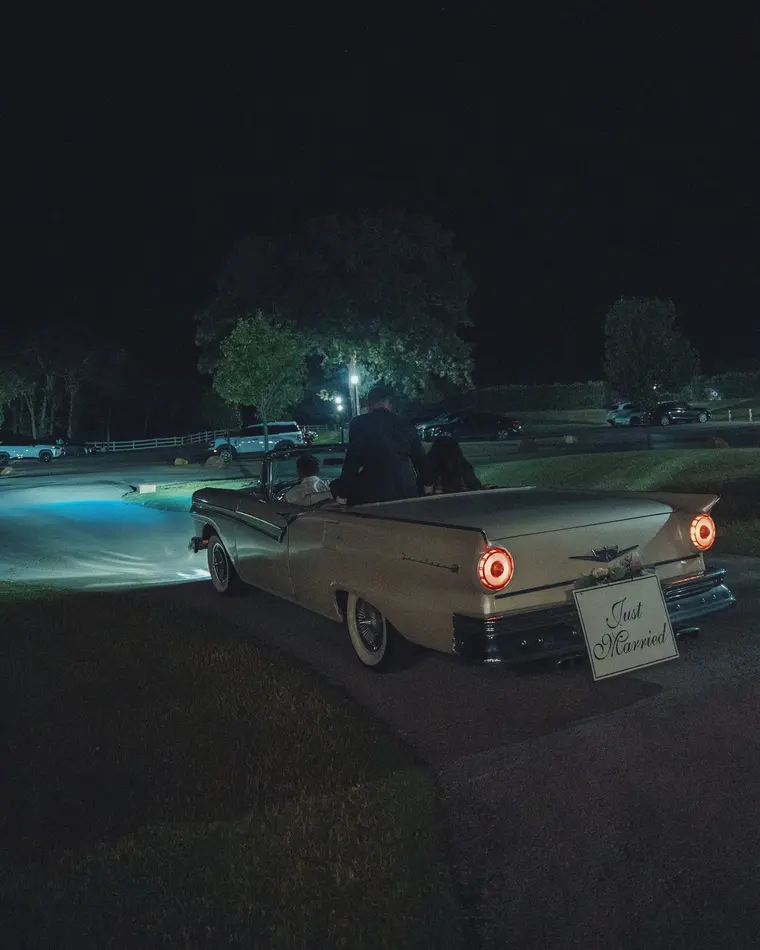 Taillights and a Just Married sign, the end of the night
